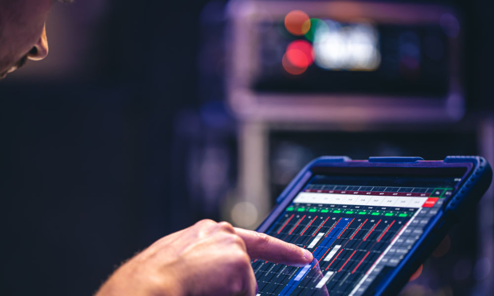 Consultant reviewing live automation and controls data on a tablet